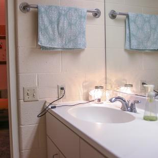 Bathroom sink area of a student suite in Cook Residence Hall.