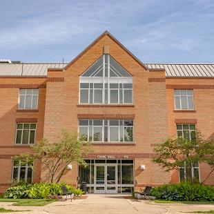 The exterior and front entrance of  Cook Residence Hall.