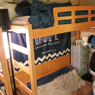 Beds lofted in a student room