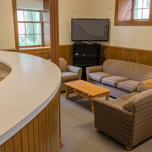 Van Vleck Residence Hall lounge with seating area.