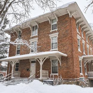 Exterior front of Van Vleck Residence Hall after a snowfall