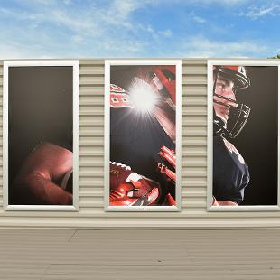 The open sky deck features A three-panel photo display showcasing a a student in his football gear.